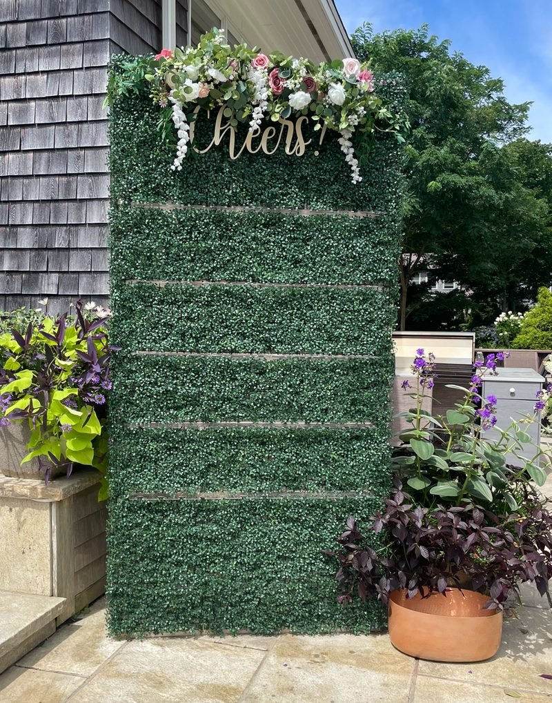 Boxwood wall with florals